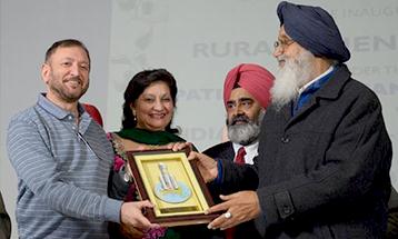 Dr.Zora Singh being conferred an award by Former CM Punjab Sardar Prakash Singh Badal - Desh Bhagat University